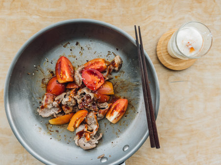 Top view of grilled seafood salad with tomatoes and coffee on tableの写真素材