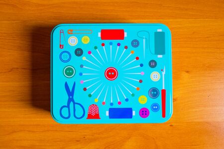 Blue color metal box on a wooden tableの写真素材
