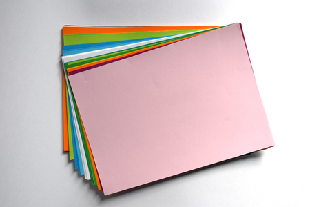 Block of colored A4 sheets on a white background, pink colorの写真素材