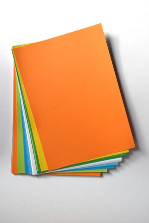 Block of colored A4 sheets on a white background, orange colorの写真素材