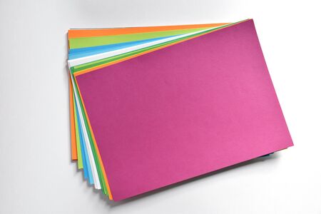 Block of colored A4 sheets on a white background, magenta colorの写真素材