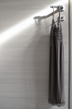 Fashion babydoll on illuminated doorの写真素材