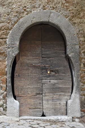Ancient wooden and stone doorの写真素材