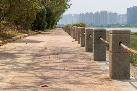 Stone walkway along the riverside in Shenzhen, China.の写真素材