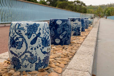 Colorful ceramic vases on the walkway in the park.の写真素材