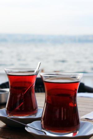 Two cups of Turkish tea on a table in Istanbulの写真素材