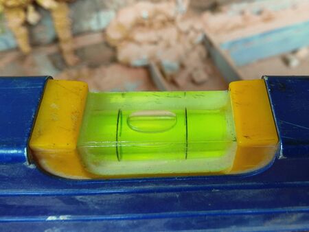 Part of spirit level. Horizontally aligned bubble mark