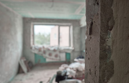 Major overhaul preparing. Empty apartment with broken wallの写真素材