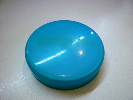 Blue Spot reflecting the light on the White Backgroundの写真素材