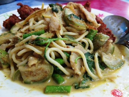 Spaghetti in the Pork Green Curry with Deep Fried Pork Ballの写真素材