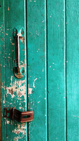 Old Green Wooden Door with Keyの写真素材
