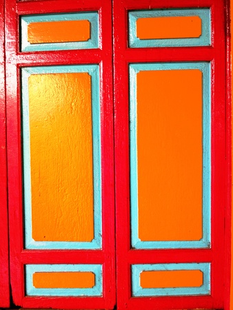Old Red and Yellow Wooden Windowの写真素材