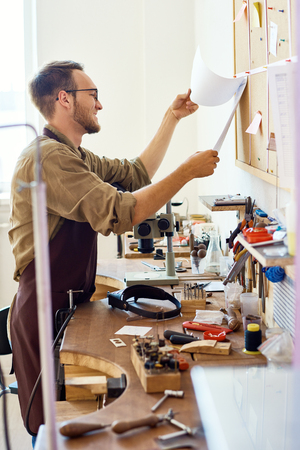 Man Working in Small Studioの写真素材