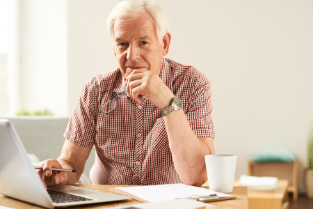 Senior Man Working  From Homeの写真素材