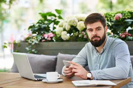 Successful  Businessman Working in Cafeの写真素材