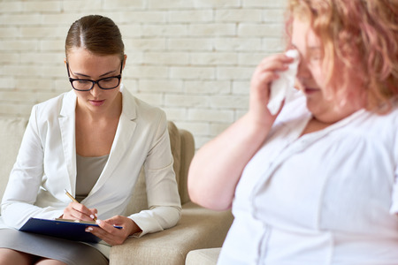 Psychiatrist Listening to Crying Patientの写真素材