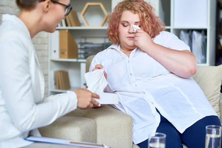 Obese Young Woman  Discussing Mental Problems with Psychiatristの写真素材