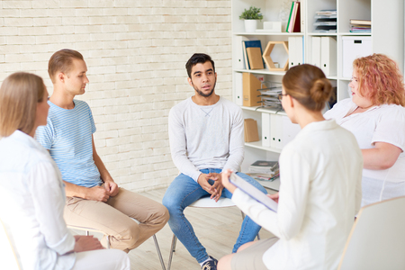 Young People in Group Therapy Sessionの写真素材