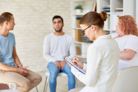Young Female Psychologist Leading Therapy Sessionの写真素材