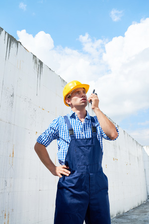 Construction Foreman Using Portable Radioの写真素材