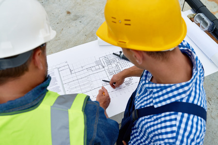 Builders Checking Floor Plans on Siteの写真素材