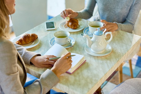 Two Businesswomen Meeting at Lunch Breakの写真素材