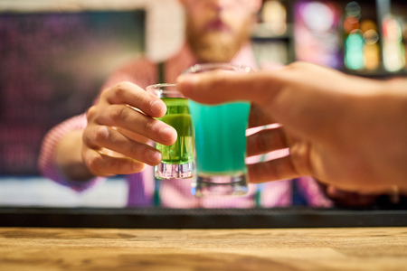 People Clinking Shots in Barの写真素材