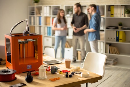 3D Printer on Table in Modern Design Studioの写真素材