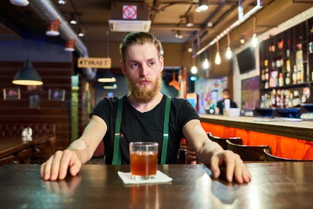 Bearded Man at Table in Pub