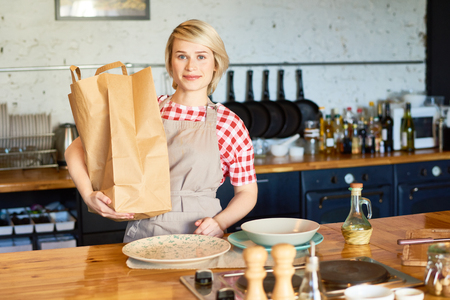Cheerful Housewife in Kitchenの写真素材