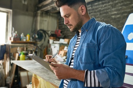 Man Planning Project in Workshop