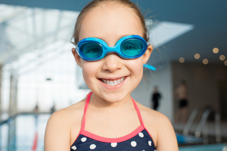 Joyful Little Swimmer with Toothy Smileの写真素材