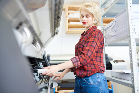 Young Woman Working with Plotterの写真素材