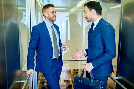 Two Businessmen in Elevatorの写真素材