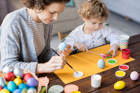 Family Painting Easter Eggsの写真素材