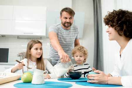 Modern Family Enjoying Breakfastの写真素材