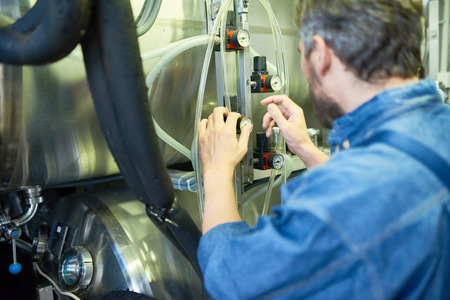 Bearded Brewer Adjusting Pressure