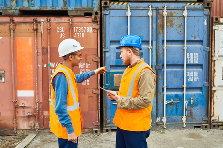 Dock Workers Discussing Shipping