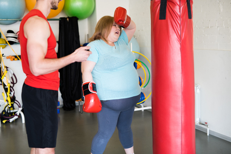 Exhausted Obese Woman in Trainingの写真素材