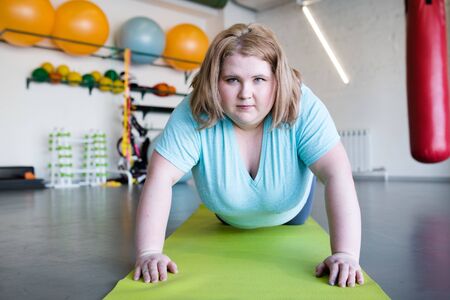 Motivated Obese Woman in Workoutの写真素材