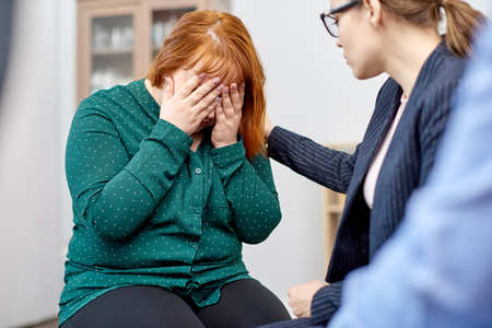 Psychologist Supporting Female Patientの写真素材