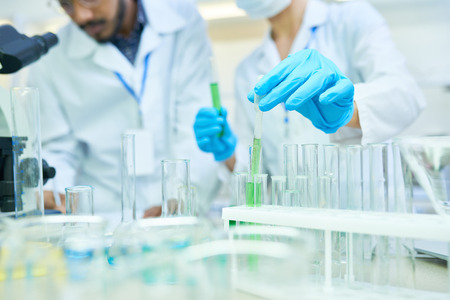 Medical colleagues holding research in lab