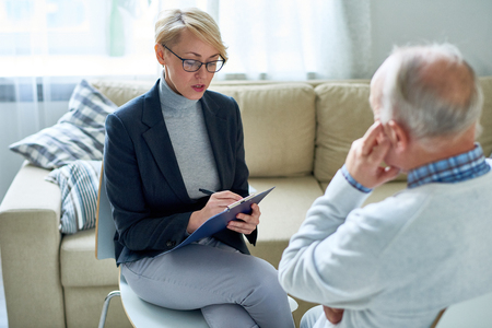Female Psychologist Consulting Senior patientの写真素材