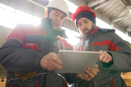 Factory Workers Using Tabletの写真素材