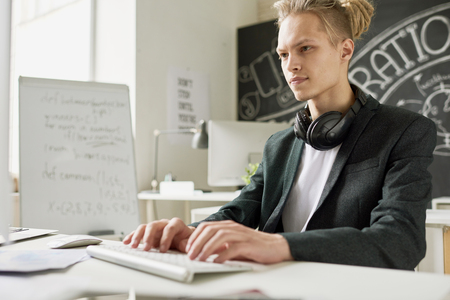 Hipster hacking computerの写真素材