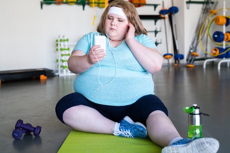 Obese Woman in Fitness Clubの写真素材