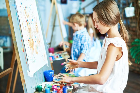 Talented Little Girl in Art Studioの写真素材