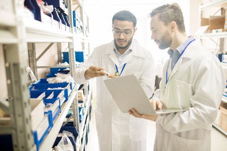 Qualified technicians analyzing measuring devicesの写真素材