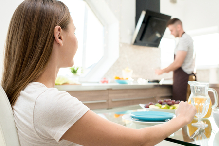 Woman waiting for breakfast from loverの写真素材