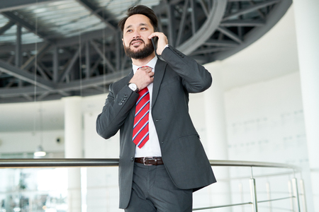 Bearded Businessman Talking on Smartphoneの写真素材